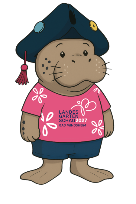 Maskottchen Stellario, eine Seekuh in rundlicher, cartoonartiger Form mit fränkischem Dreispitz, kurzer Hose, magentafarbenem T-Shirt mit weißen Blützen und Logo der LGS